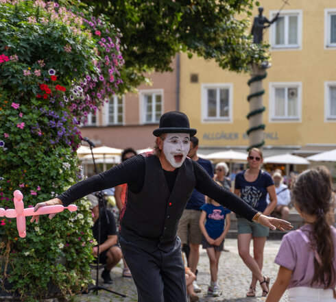 An artist offers a phantom mime performance in the old town of Füssen