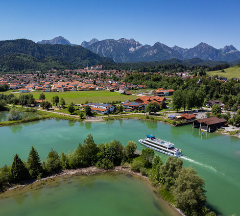 Panorama picture of Füssen with the Forggensee and Forggensee shipping